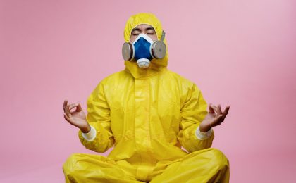 Man in protective suit meditating